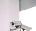 two bullet security camera attached on wall